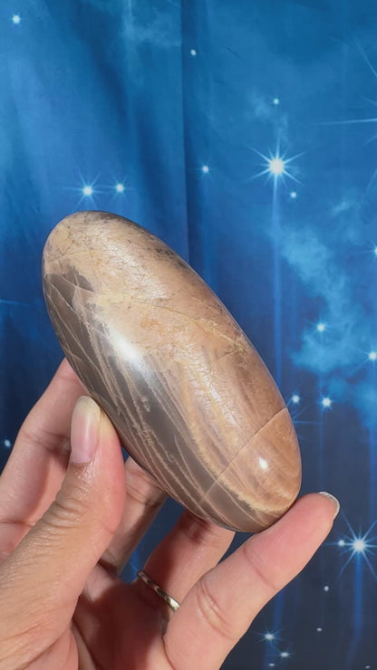 Peach moonstone with sunstone lingam - 4" × 1 3/4" × 1 3/4" - 9.9 oz